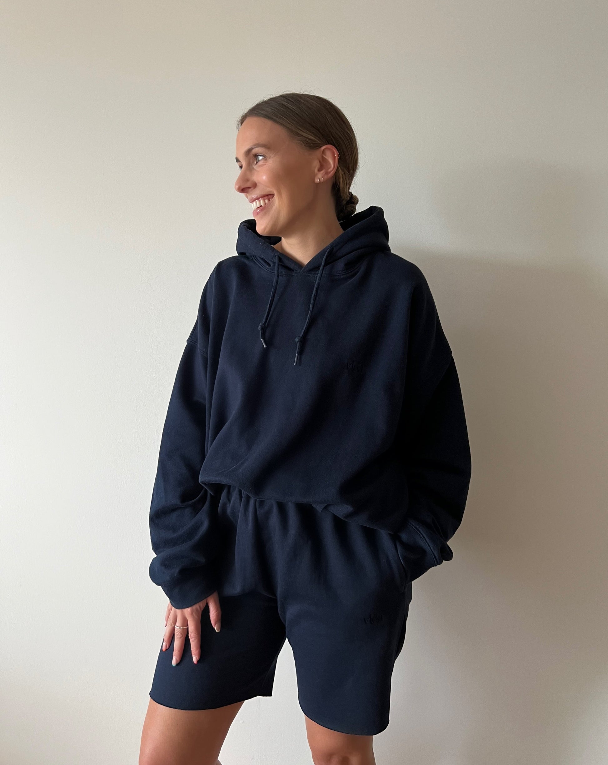 Our navy hoodie is the perfect lounge piece. Why not go oversized for ultimate comfort?