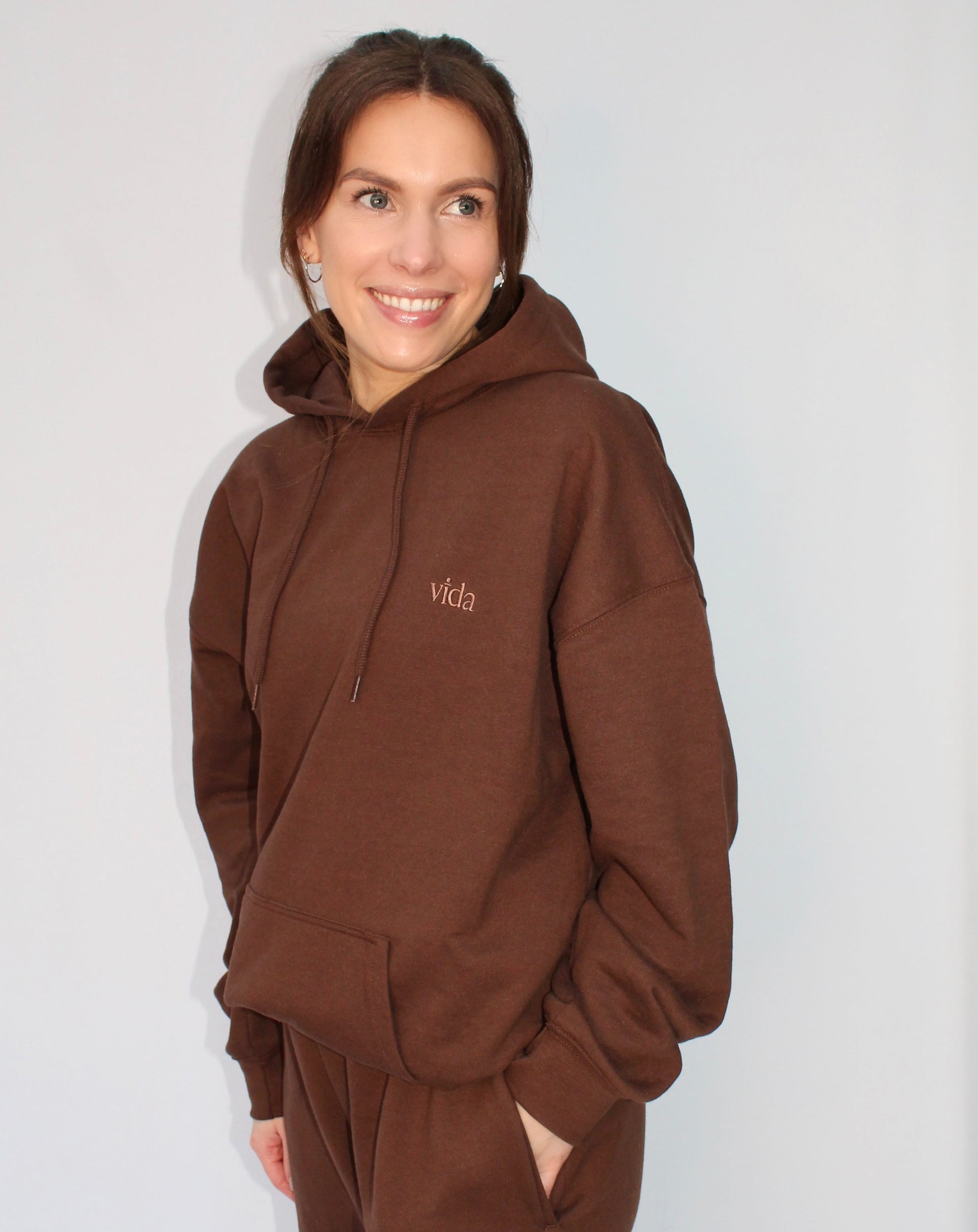 Chocolate coloured hooded sweatshirt with drawstring detail and front pouch pocket